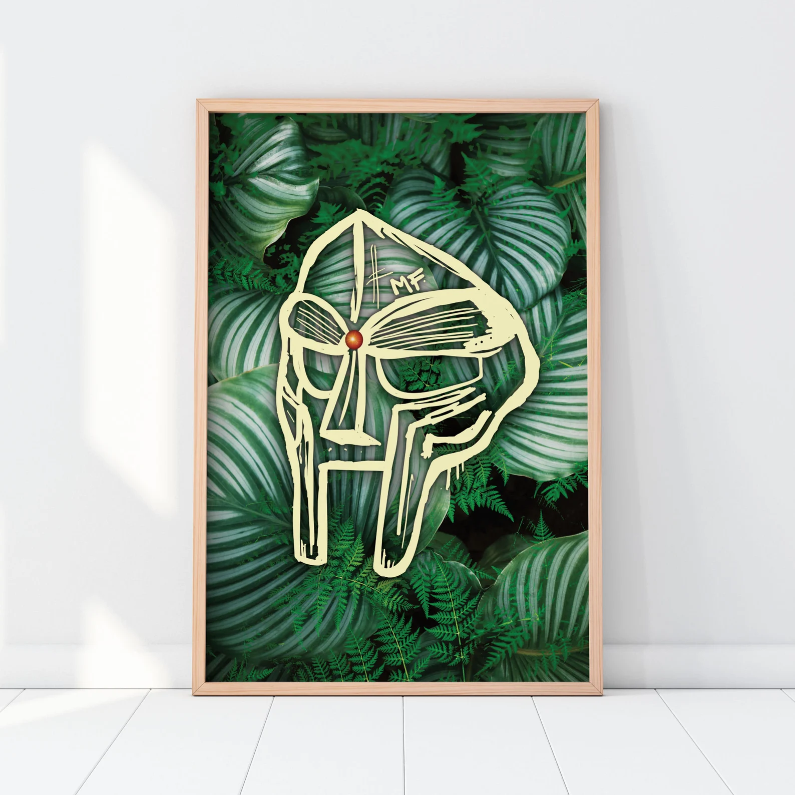 MF DOOM print with green leaf background and cream mask artwork.